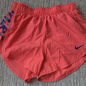 Nike Women's Coral Athletic Running Shorts with Purple Logo